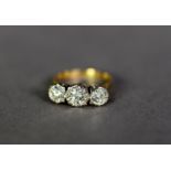 18ct GOLD THREE STONE DIAMOND RING, the brilliant illusion set stones with a total carat weight of