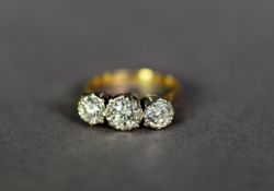 18ct GOLD THREE STONE DIAMOND RING, the brilliant illusion set stones with a total carat weight of