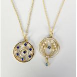 TWO EDWARDIAN STYLE 9ct GOLD CIRCULAR OPENWORK PENDANTS one set with TINY BLUE STONES and SEED