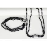 TRIPLE STRAND NECKLACE OF FACETED ROUND JET BEADS, each strand with uniform beads, but the strands