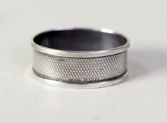 SILVER OVAL NAPKIN RING with engine turned decoration, Birmingham 1951 and a SILVER CIRCULAR