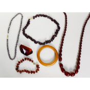 LARGE GOLDEN AMBER, CONTINUOUS NECKLACE of amber beads; BEAD BRACELET; BANGLE and 2 NECKLACES (6)