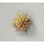VICTORIAN GOLD EIGHT POINT STAR BROOCH PENDANT set with a centre old cut round diamond,