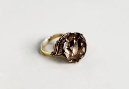 14k LARGE TOPAZ claw set RING, the shank issuing two leaves at the shoulder, 9.2gms