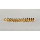 18ct GOLD BAR BROOCH in the form of curb pattern links, each link hallmarked, 2 1/4in (5.75cm) long,