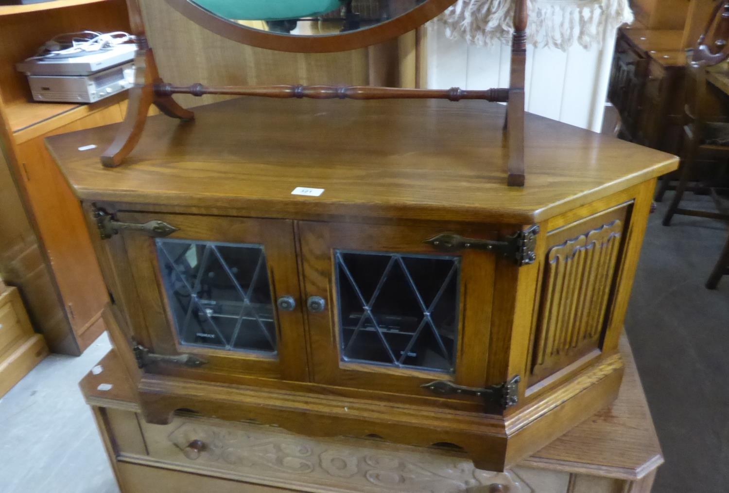 AN OAK CORNER TELEVISION STAND AND A DVD PLAYER (2)