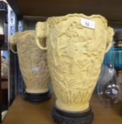 PAIR OF LARGE ORIENTAL IVORINE TAPERING VASES, CAVE RELIEVO WITH ISLANDS, BUILDINGS AND TWO FEMALE