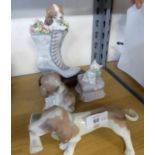 FOUR LLADRO GROUPS OR MODELS OF DOGS, comprising: ‘A WELL HEALED PUPPY’, modelled as a puppy and