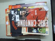 SELECTION OF LATE 1990s MANCHESTER UNITED REVIEW FOOTBALL PROGRAMMES AND A SELECTION OF RELATED