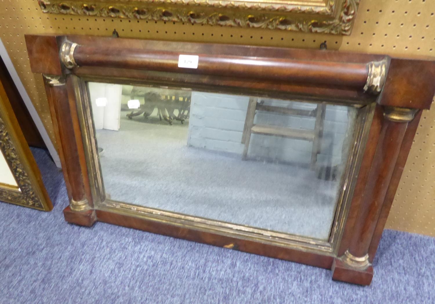EARLY NINETEENTH CENTURY MAHOGANY AND PARCEL GILT WALL MIRROR, with split columns and oblong