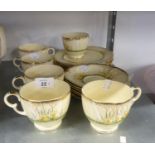 AN 18 PIECE CROWN DEVON 'SPRINGWOOD' TEA SERVICE IN YELLOW AND FLORAL DECORATION