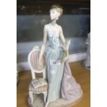 LLADRO ‘LADY OF TASTE’ PORCELAIN FIGURE, modelled as an elegant lady carrying flowers and standing