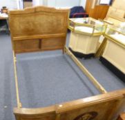 FRENCH BURR WALNUT AND TULIP WOOD CROSSBANDED DOUBLE BEDSTEAD, the bow fronted footboard with oval