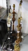 A PAIR OF BLACK SLENDER TABLE LAMPS, A PAIR OF GILT TABLE LAMPS AND TWO  OTHER GILT TABLE LAMPS (6)