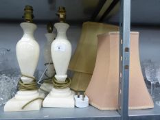 SET OF THREE WHITE ALABASTER VASE SHAPED TABLE LAMPS, ON SQUARE BASES AND TWO FABRIC SHADES AND A