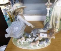 LLADRO PRIVELEGE ‘PUPPY PARADE’ PORCELAIN GROUP, modelled as a young girl walking two dogs on