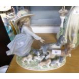 LLADRO PRIVELEGE ‘PUPPY PARADE’ PORCELAIN GROUP, modelled as a young girl walking two dogs on