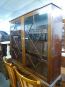 MAHOGANY TWO DOOR DISPLAY CABINET HAVING ASTRAGAL GLAZED DOORS AND RAISED ON SHORT CLAW AND BALL