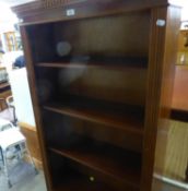 A MAHOGANY FOUR TIER OPEN BOOKCASE WITH BASAL CUPBOARD