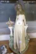 LLADRO ‘TIME FOR REFLECTION’ PORCELAIN FIGURE, modelled as an elegant lady standing in front of