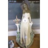 LLADRO ‘TIME FOR REFLECTION’ PORCELAIN FIGURE, modelled as an elegant lady standing in front of