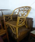A BAMBOO TUB SHAPED CONSERVATORY ARMCHAIR (NO CUSHIONS)