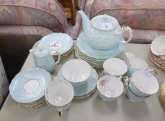 AYNSLEY CHINA TEA SET FOR SIX PERSONS, PALE BLUE AND GILT WITH PRINTED DECORATION OF PINK ROSES,