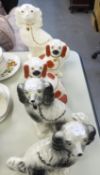 TWO PAIRS OF TWENTIETH CENTURY STAFFORDSHIRE POTTERY MANTEL DOGS, THE SMALLER PAIR WITH IRON RED