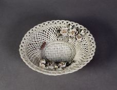 IN THE STYLE OF BELLEEK, UNMARKED CIRCULAR BISQUE PORCELAIN BASKET, with three strand looped
