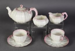 BELLEEK PINK 'TRIDACNA' PATTERN TETE A TETE with TEAPOT, having low domed cover, with loop finial, 7