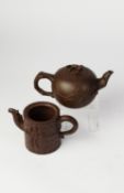 CHINESE YIXING STONEWARE TEAPOT, the chocolate brown body moulded in relief with squirrels on