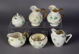 BELLEEK EARLY TWENTIETH CENTURY TRIPLE SHELL PATTERN SMALL GLOBULAR MUSTARD POT AND COVER AND