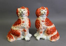 PAIR OF VICTORIAN STAFFORDSHIRE POTTERY MANTEL DOGS, well-modelled with free-standing front loeg,