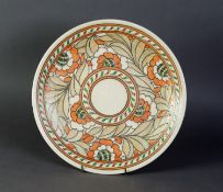 CHARLOTTE RHEAD SIGNED CIRCULAR PLAQUE, flowers and foliage design, in mainly orange, fawn, scroll