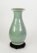 CHINESE LATE QING DYNASTY GREEN STONEWARE CELADON GLAZED BALUSTER SHAPE VASE, moulded in low