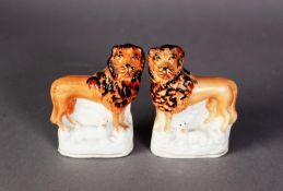 PAIR OF VICTORIAN STAFFORDSHIRE POTTERY FLAT-BACK MINIATURE MODELS OF A LION AND LAMB, the lions