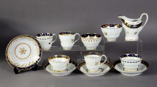 THREE LATE EIGHTEENTH CENTURY WORCESTER FLUTED CHINA TRIO'S,  each with dark blue and gilt