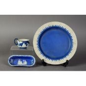 NINETEENTH CENTURY WEDGWOOD DARK BLUE DIPPED JASPERWARE POTTERY SIDE PLATE, sprigged in white with a