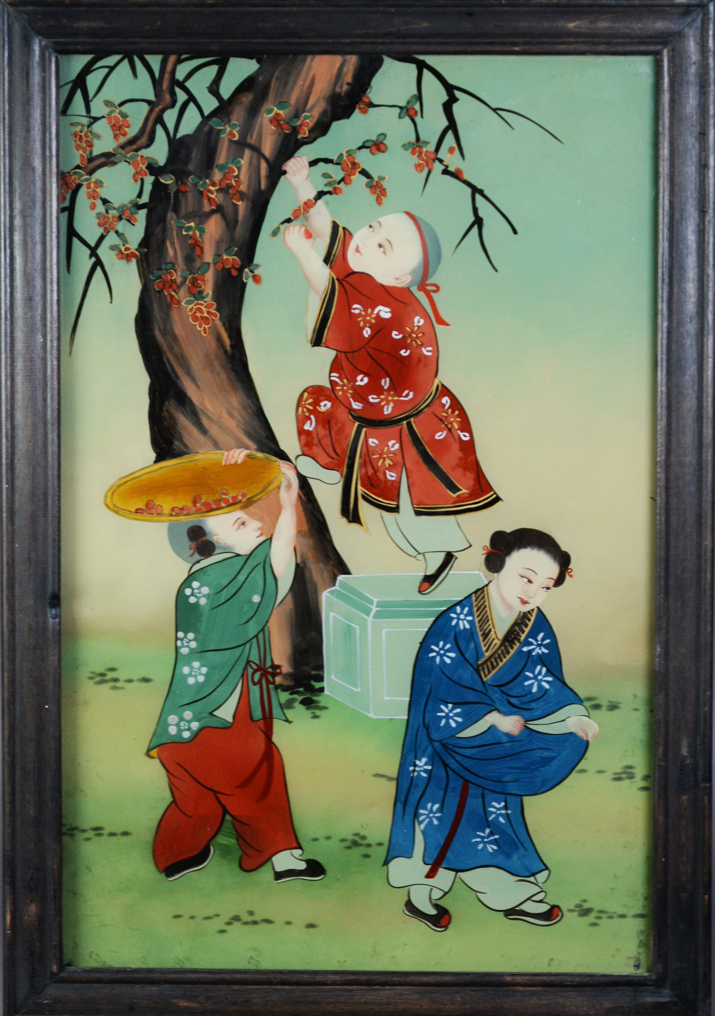 TWENTIETH CENTURY CHINESE REVERSE PAINTED GLASS PICTURE of three figures gathering blossom from a - Image 2 of 2