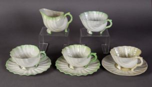 THREE EARLY TWENTIETH CENTURY 'GREEN NEPTUNE' PATTERN TEA CUPS AND TWO SAUCERS, the cups raised on