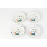 FOUR 20th CENTURY ORIENTAL PORCELAIN SAUCERS with shaped rims, each polychrome enamelled with a bird