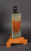 WILLIAM HOWSON TAYLOR, RUSKIN POTTERY ART DECO TRIANGULAR ELECTRIC TABLE LAMP, the column covered in