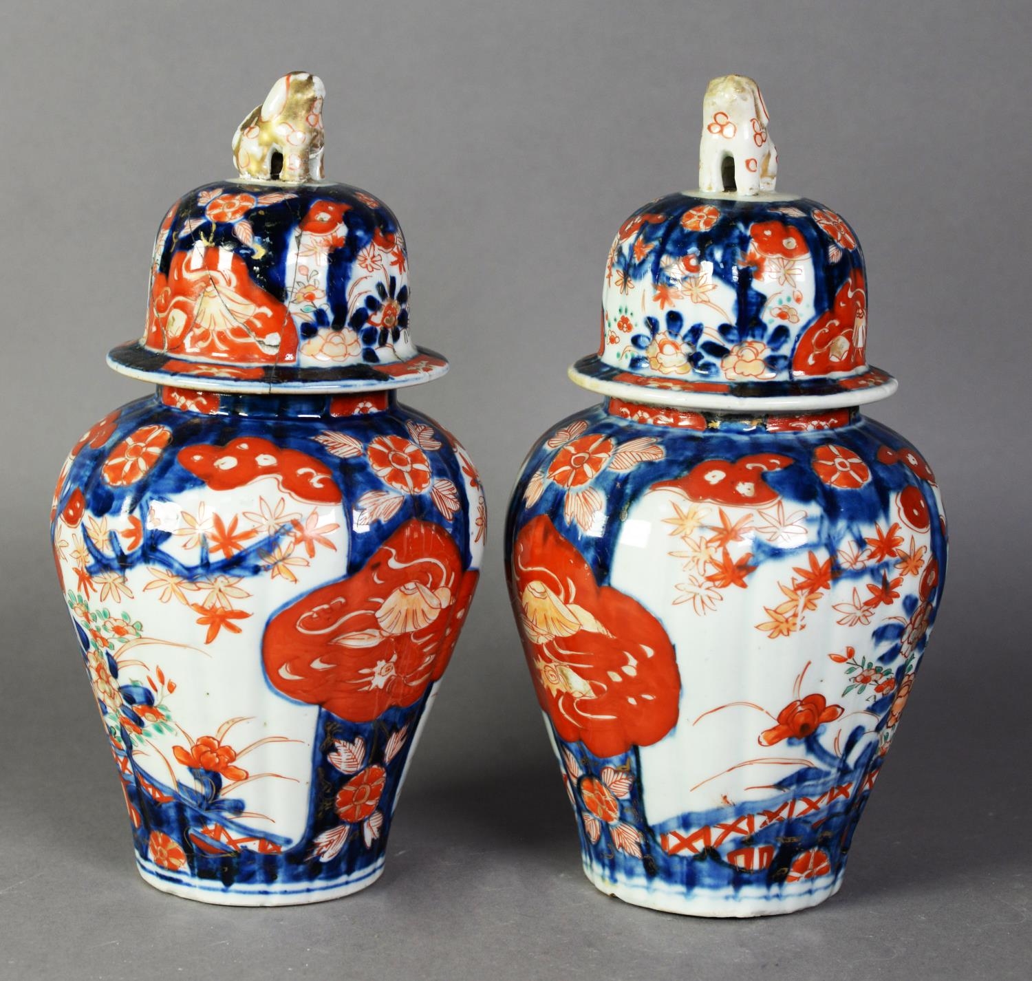 PAIR OF JAPANESE MEIJI PERIOD IMARI PORCELAIN RIBBED INVERTED BALUSTER SHAPE COVERED JARS, 10 1/