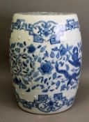 TWENTIETH CENTURY CHINESE BLUE AND WHITE POTTERY BARREL SHAPED GARDEN SEAT, outlined and washed with