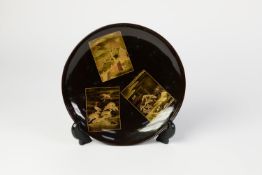 JAPANESE LATE MEIJI PERIOD BLACK AND GOLD LACQUER SAUCER DISH, the centre with three floating