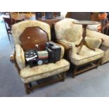 A PAIR OF OAK FRAMED EASY ARMCHAIRS EACH WITH A CARVED AND ARCADED FIVE RAIL BACK, RAILED SIDES,