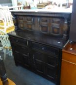 AN OAK REPRODUCTION PRIORY COURT CUPBOARD, A DROP-LEAF DINING TABLE RAISED ON BOBBIN LEGS AND A PAIR