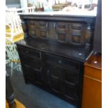 AN OAK REPRODUCTION PRIORY COURT CUPBOARD, A DROP-LEAF DINING TABLE RAISED ON BOBBIN LEGS AND A PAIR