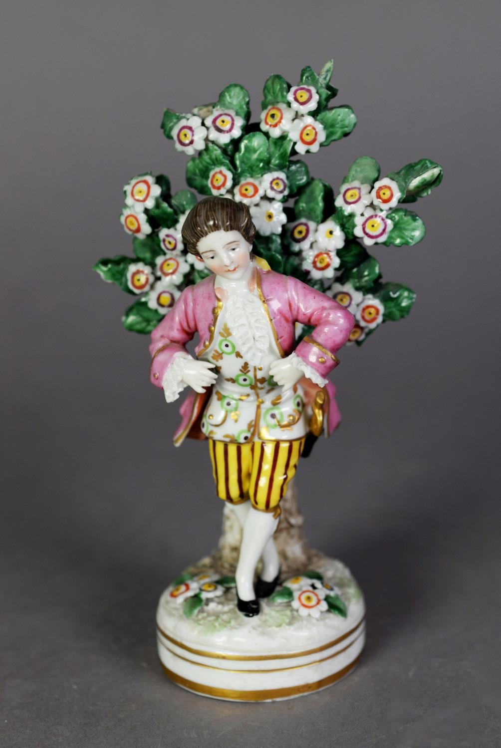 NINETEENTH CENTURY PORCELAIN FIGURE OF A COURTIER, painted in colours and gilt and modelled