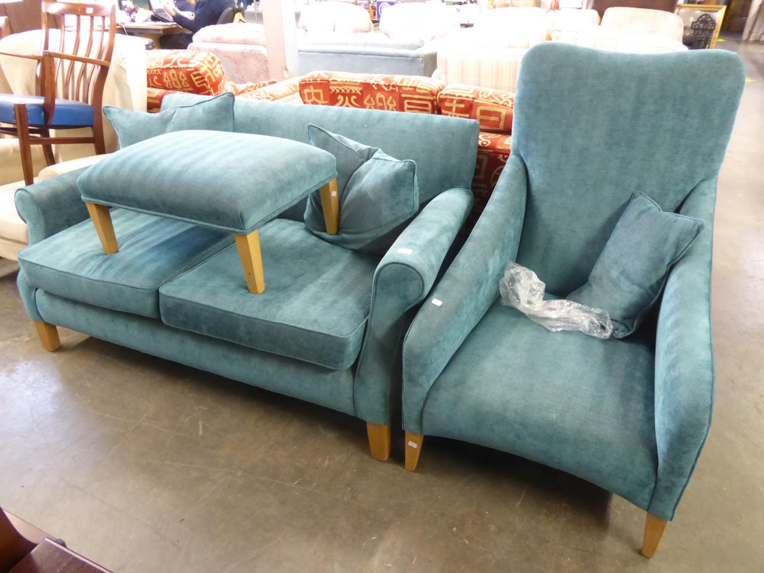 A LOUNGE SUITE OF THREE PIECES COVERED IN BLUE TEXTURED FABRIC, VIZ A TWO SEATER SETTEE, A LOUNGE